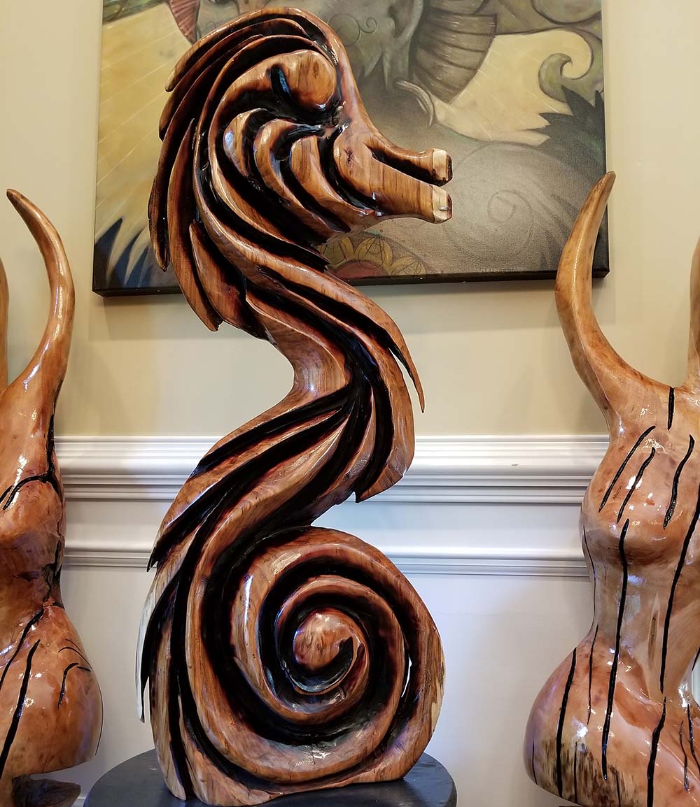 Chainsaw carving of curvy seahorse by SpiritCurves Gregor